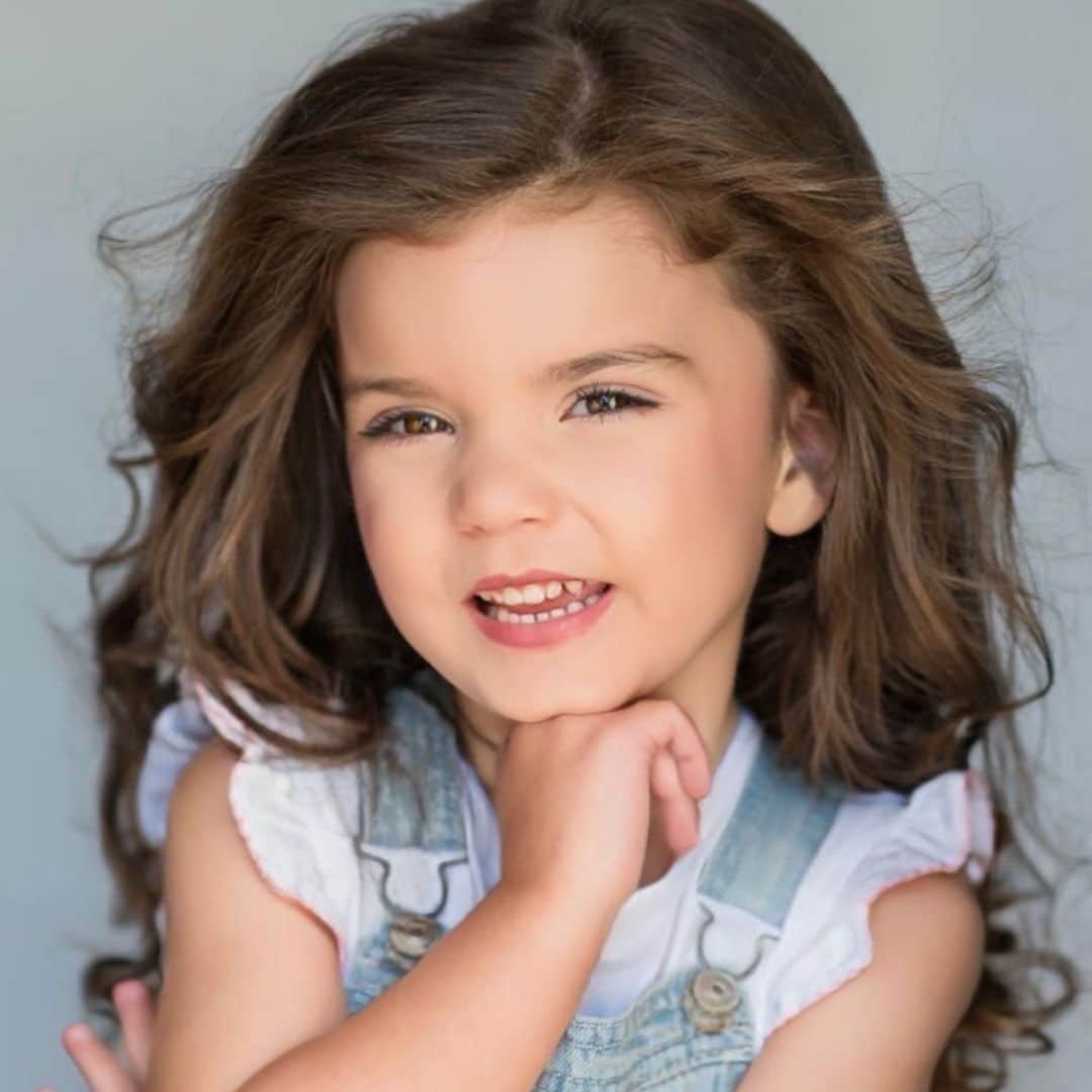 Young girl smiling with long brown hair