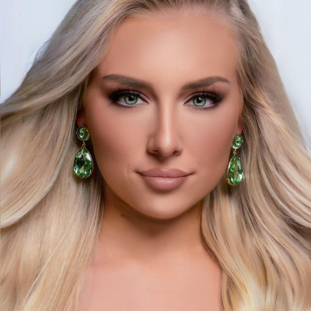 Woman with green earrings and blonde hair