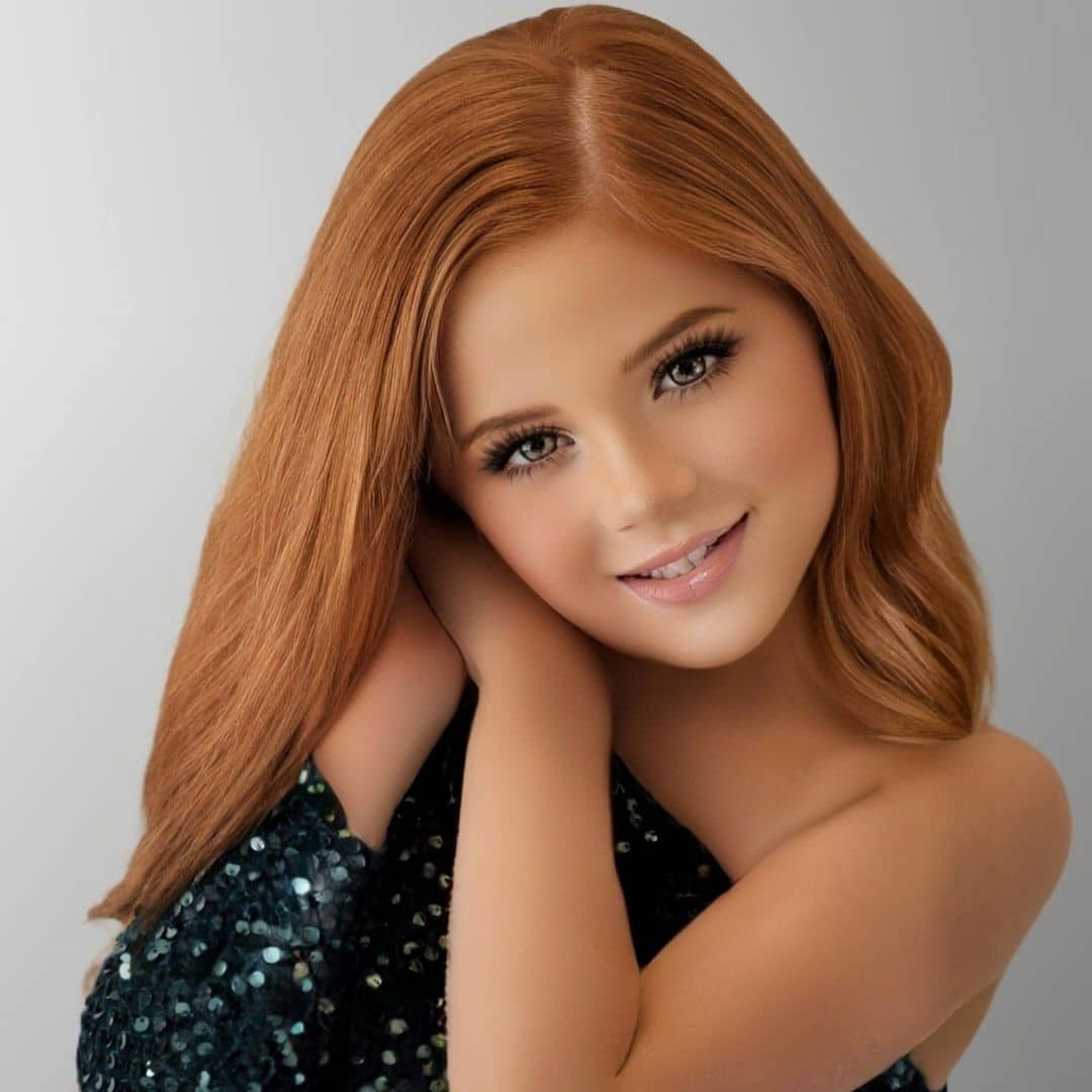 Smiling girl with long red hair