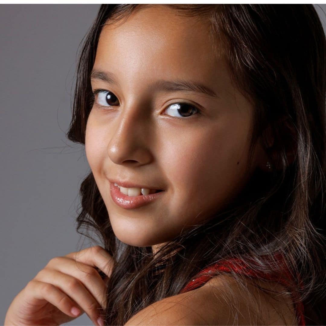 Smiling girl with long dark hair