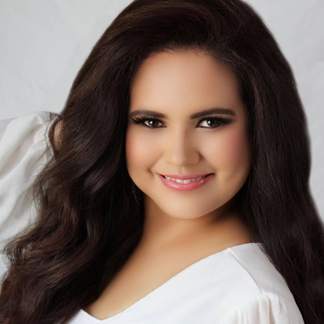 Smiling woman with wavy dark hair